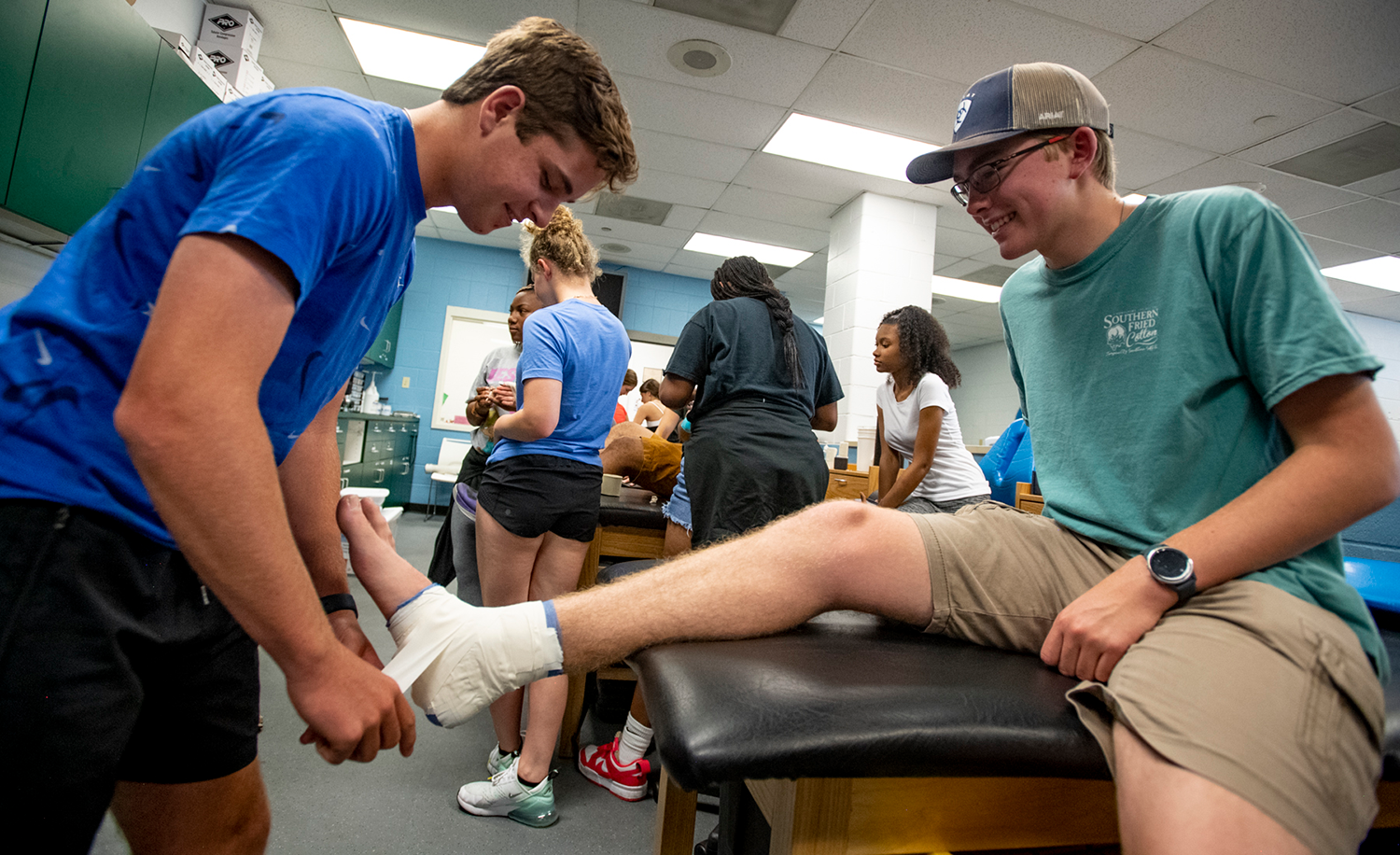 Students learn how to tape injuries in their Sports Medicine class.