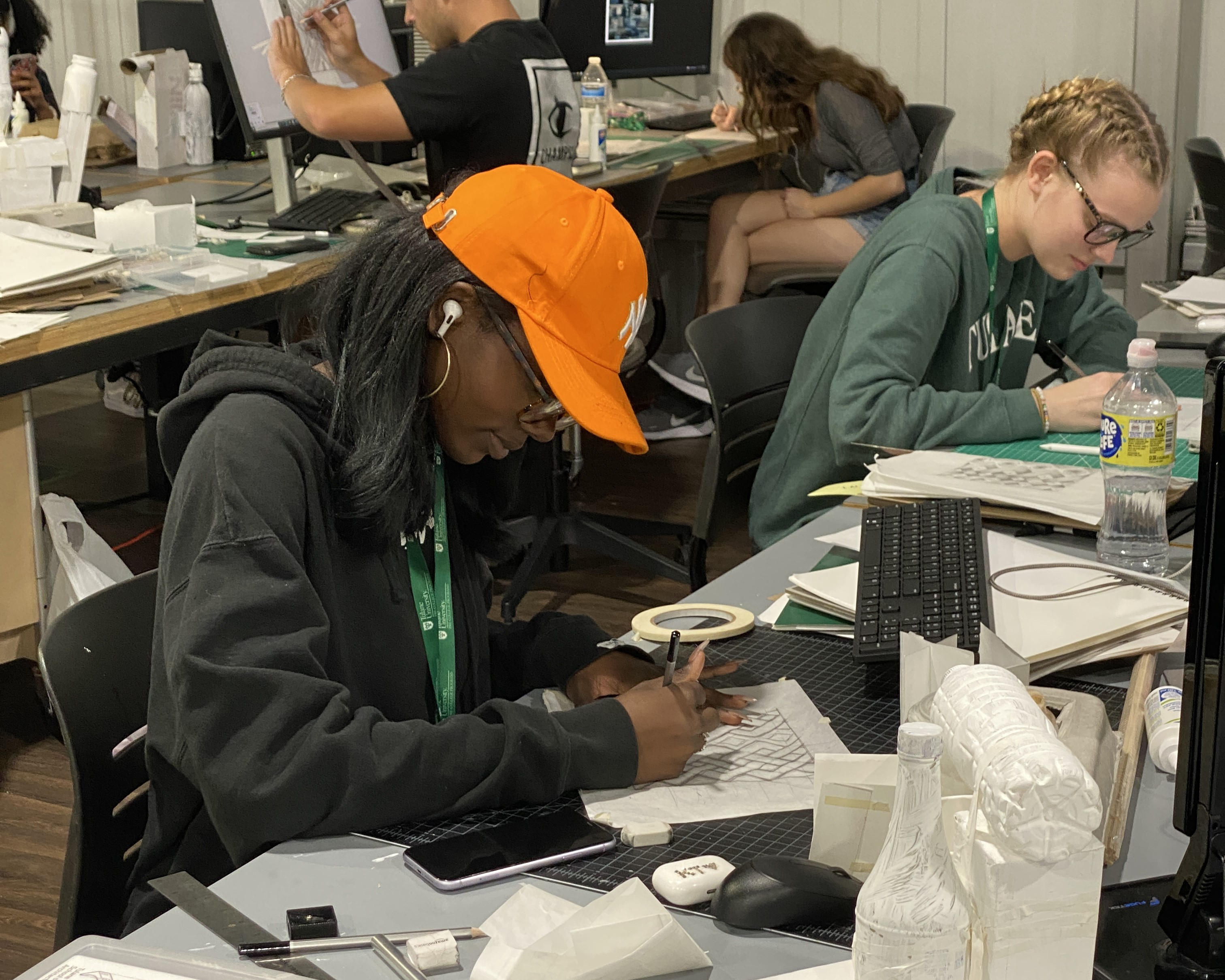 Pre-college students creating architectural designs in studio