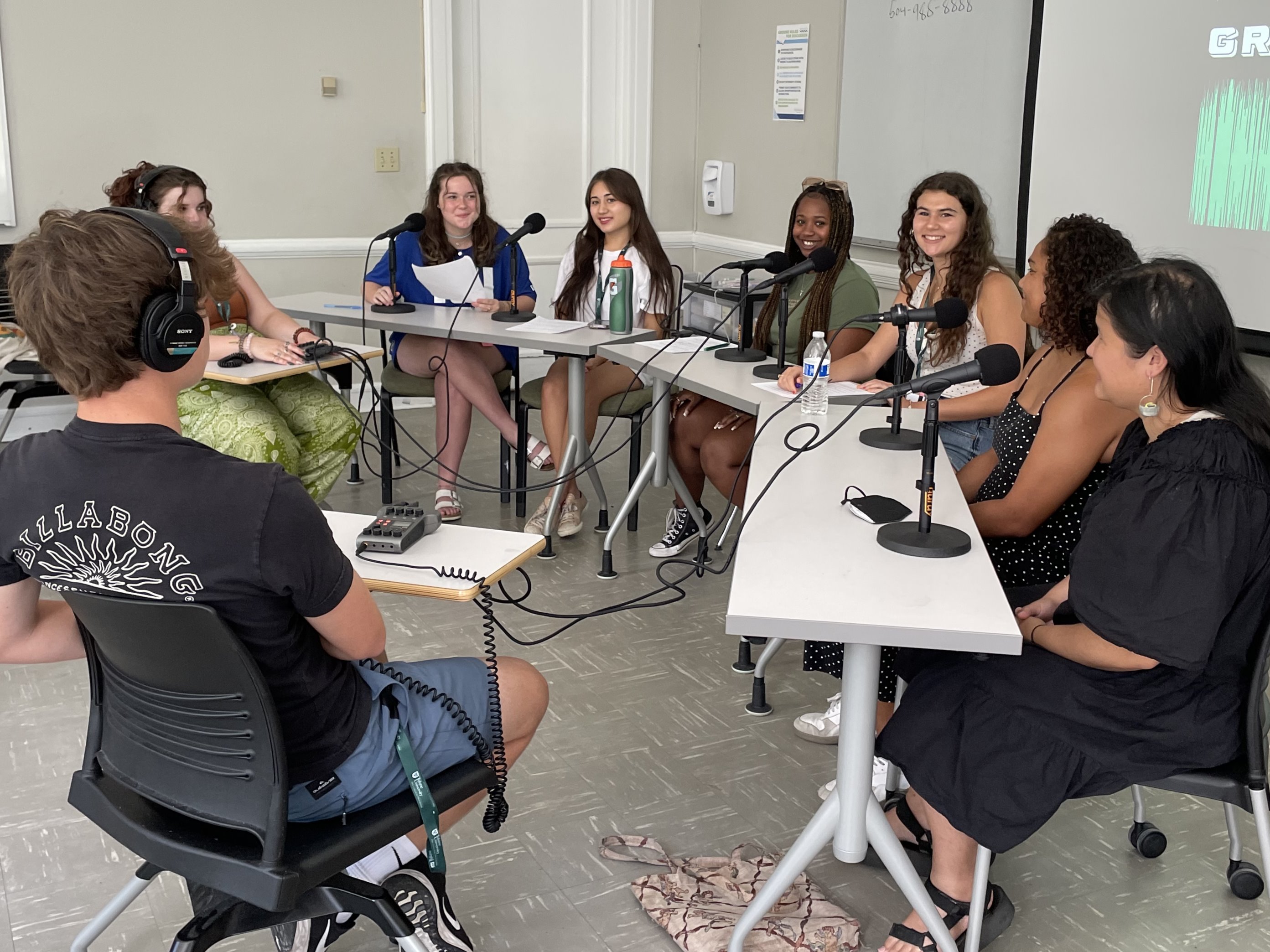Pre-college students creating a podcast about social injustice