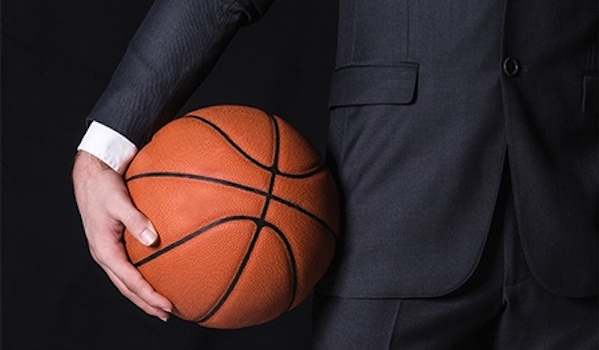 A Sports Agent Holds a Basketball Sports Marketing