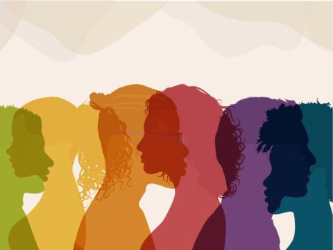 Diverse, overlapping translucent human profiles in a rainbow of colors.