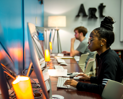 Student works on lap top in course.