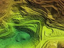 3D graphic of a terrain, colors shifting from green to yellow for elevation.